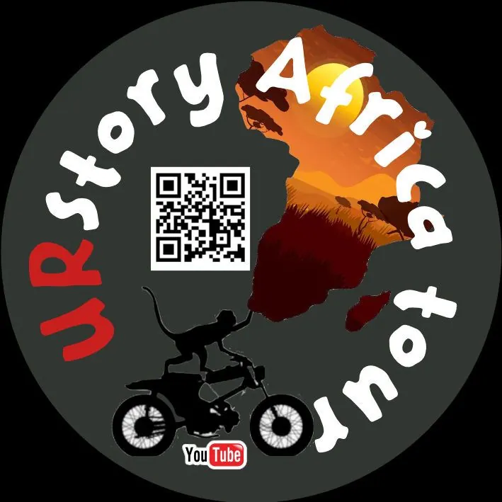 A round badge reading URstory Africa tour, with a QR code, a map of Africa, a rider on a motorbike and a YouTube logo.
