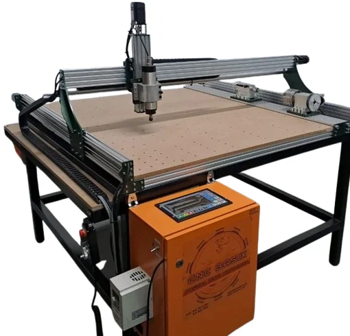A CNC router machine on a black steel stand: a gantry with a cutting spindle above a large brown work board, and an orange control box with a display at the front.